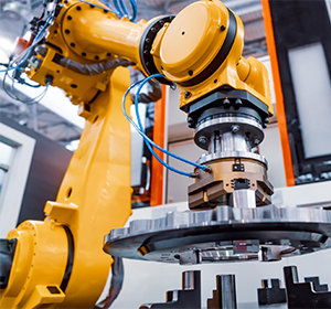 Robotic arm engaged in machine maintenance work